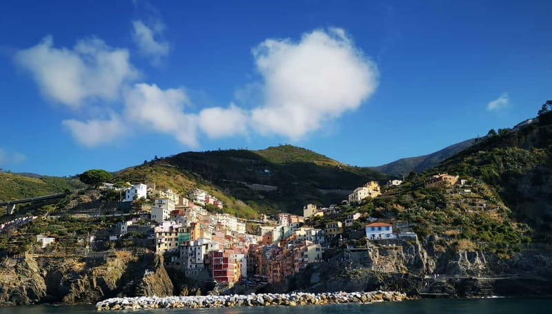 From Florence: Small-group to Cinque Terre and Pisa Day Tour - Riomaggiore: alleys, a tiny pebble beach, and optional Via Beccara